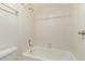 Bright bathroom featuring a white tiled bathtub with a shower and classic fixtures at 609 E Mesquite Cir # D133, Tempe, AZ 85288