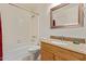 Bathroom featuring shower tub combo, mirror, and granite vanity at 609 E Mesquite Cir # D133, Tempe, AZ 85288