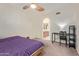 Bedroom with ceiling fan, carpeted floor, and access to a private bathroom at 609 E Mesquite Cir # D133, Tempe, AZ 85288