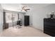 Spacious bedroom with a ceiling fan, natural light and a neutral color scheme at 609 E Mesquite Cir # D133, Tempe, AZ 85288