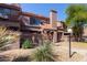 Attractive two-story townhome featuring a well-kept desert landscape and tile roof at 609 E Mesquite Cir # D133, Tempe, AZ 85288