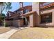 Charming two-story townhome featuring a desert landscape and a tiled roof at 609 E Mesquite Cir # D133, Tempe, AZ 85288