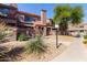 Attractive two-story townhome with a well-maintained desert landscape and tile roof at 609 E Mesquite Cir # D133, Tempe, AZ 85288