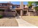 Charming townhouse with a red tile roof and a walkway leading to the front door at 609 E Mesquite Cir # D133, Tempe, AZ 85288