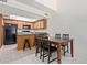 Eat-in kitchen with stainless steel appliances, skylight, and tile floors at 609 E Mesquite Cir # D133, Tempe, AZ 85288