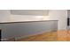 Cozy loft space with hardwood flooring and a view of the downstairs area through the railing at 609 E Mesquite Cir # D133, Tempe, AZ 85288