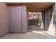 This patio features a sliding glass door and an entry door with a secure keypad entry system at 609 E Mesquite Cir # D133, Tempe, AZ 85288