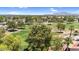 Overhead view of a lush green golf course with mature trees and residential surroundings at 6461 S Oakmont Dr, Chandler, AZ 85249