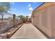 Fenced backyard with desert landscaping, complemented by a concrete patio at 6461 S Oakmont Dr, Chandler, AZ 85249