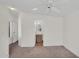 Bedroom featuring neutral carpeting, white walls, and an ensuite at 6461 S Oakmont Dr, Chandler, AZ 85249