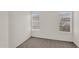 Bright bedroom filled with natural light from two large windows at 6461 S Oakmont Dr, Chandler, AZ 85249