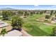 Aerial view of a lush green golf course with mature trees and community landscape at 6461 S Oakmont Dr, Chandler, AZ 85249