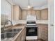 Well-lit kitchen features wood floors, modern appliances, and ample storage at 6461 S Oakmont Dr, Chandler, AZ 85249