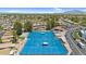 Blue tennis courts and surrounding community homes offer an active lifestyle for residents at 6461 S Oakmont Dr, Chandler, AZ 85249