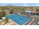 Scenic aerial view of well-maintained blue tennis courts and landscaped community surroundings at 6461 S Oakmont Dr, Chandler, AZ 85249