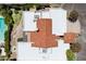 Aerial view showcases roof and property layout, highlighting the pool, and surroundings at 7319 E Rose Ln, Scottsdale, AZ 85250