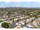 A high-angle view of the neighborhood highlighting the community's layout, greenery, and surrounding landscape at 7319 E Rose Ln, Scottsdale, AZ 85250