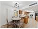 Charming dining area with built-in cabinets and a view into the kitchen at 7319 E Rose Ln, Scottsdale, AZ 85250