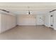 Spacious garage featuring ample built-in storage cabinets along the walls and a clean, well-lit interior at 7319 E Rose Ln, Scottsdale, AZ 85250