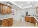 Spacious kitchen with wooden cabinets and natural lighting, seamlessly blending style and function at 7319 E Rose Ln, Scottsdale, AZ 85250