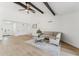Stylish living room with hardwood floors, high ceilings, neutral decor and a view of the front entry at 7319 E Rose Ln, Scottsdale, AZ 85250