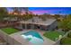 Aerial view of home with in-ground pool, lush backyard, and desert sunset at 7543 E Portland St, Scottsdale, AZ 85257