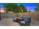 Cozy backyard featuring a modern fire pit and comfortable seating, perfect for outdoor relaxation and entertaining at 7543 E Portland St, Scottsdale, AZ 85257