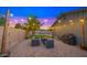 Backyard with patio furniture, BBQ, and string lights for cozy outdoor living at 7543 E Portland St, Scottsdale, AZ 85257