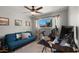 This bedroom features a sofa, desk with computer and peloton machine at 7543 E Portland St, Scottsdale, AZ 85257
