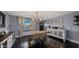 Stylish dining room with modern light fixture, decorative buffet, and dark hardwood floors at 7543 E Portland St, Scottsdale, AZ 85257