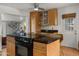 Charming kitchen with breakfast bar and ample storage at 7543 E Portland St, Scottsdale, AZ 85257