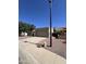 Spacious garage with ample driveway space and desert landscaping, providing convenient parking and curb appeal at 7725 W Mcrae W Way, Glendale, AZ 85308