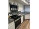 Well-lit kitchen with stainless steel appliances, granite countertops, and stylish backsplash at 7725 W Mcrae W Way, Glendale, AZ 85308