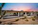 Scenic backyard featuring desert landscaping, large covered patio, and well maintained grounds, perfect for outdoor living at 8049 E Serene St, Carefree, AZ 85377