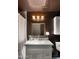 Bathroom featuring a white vanity, framed mirror, and a wall mounted cabinet at 8049 E Serene St, Carefree, AZ 85377
