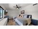 Bedroom featuring two beds, a ceiling fan, and a desert landscape view at 8049 E Serene St, Carefree, AZ 85377