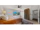 Bright bedroom featuring a ceiling fan, desert landscape view, and built in storage cabinet at 8049 E Serene St, Carefree, AZ 85377