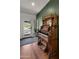 Inviting entryway with a vintage organ, hardwood floors, and a view of the desert landscape through the glass door at 8049 E Serene St, Carefree, AZ 85377