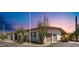 Desert home featuring attached two-car garage, desert landscaping, and a charming pergola covered entry way at 8049 E Serene St, Carefree, AZ 85377