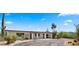 Charming home exterior featuring a well-manicured yard and desert landscaping elements at 8049 E Serene St, Carefree, AZ 85377