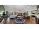 Open-concept kitchen features green cabinetry, a round dining table with hardwood floors, and stainless steel appliances at 8049 E Serene St, Carefree, AZ 85377