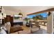 Relaxing outdoor living area with comfortable seating, a TV, and stunning views of the Arizona landscape at 8049 E Serene St, Carefree, AZ 85377