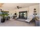 Inviting outdoor patio with comfortable seating, a ceiling fan, and views of the natural desert setting at 8049 E Serene St, Carefree, AZ 85377