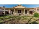 Backyard featuring patio seating and perimeter fencing at 8566 N 108Th Ln, Peoria, AZ 85345