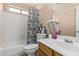 Neutral-toned bathroom has a tub and shower combination, a toilet, and a single sink vanity at 8566 N 108Th Ln, Peoria, AZ 85345