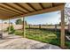 View of the covered patio with a concrete floor and view of the backyard at 8566 N 108Th Ln, Peoria, AZ 85345
