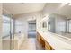 Bright bathroom featuring a soaking tub, glass-enclosed shower, and long vanity at 1037 E Baylor Ln, Gilbert, AZ 85296