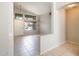 Welcoming entryway offers high ceilings, natural light, and neutral tile flooring throughout at 1037 E Baylor Ln, Gilbert, AZ 85296