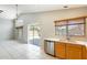 Spacious kitchen with stainless appliances, a window, and a sliding door to the backyard at 1037 E Baylor Ln, Gilbert, AZ 85296
