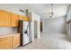 Open floor plan features a kitchen with stainless appliances and an adjacent living space at 1037 E Baylor Ln, Gilbert, AZ 85296